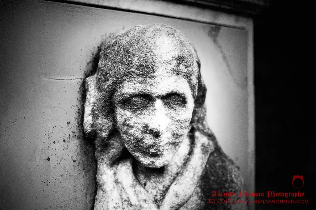 Photograph of a lady on a headstone
