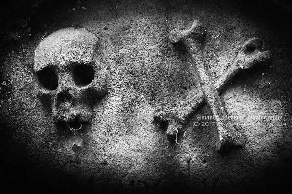 Skull and crossbones on a headstone