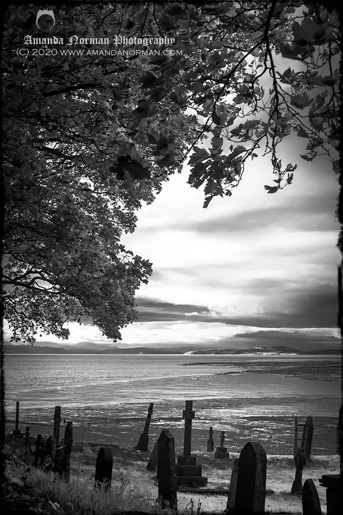 Photograph of headstones against Morecambe Bay
